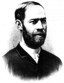 Black and white portrait of a man with a short beard looking to the right