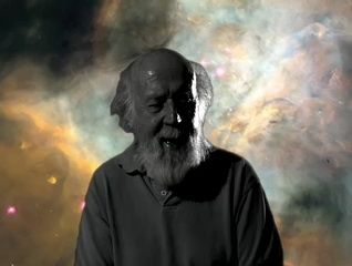 Black and white photo of a man with a beard against a cloudy, yellowish and bluish background